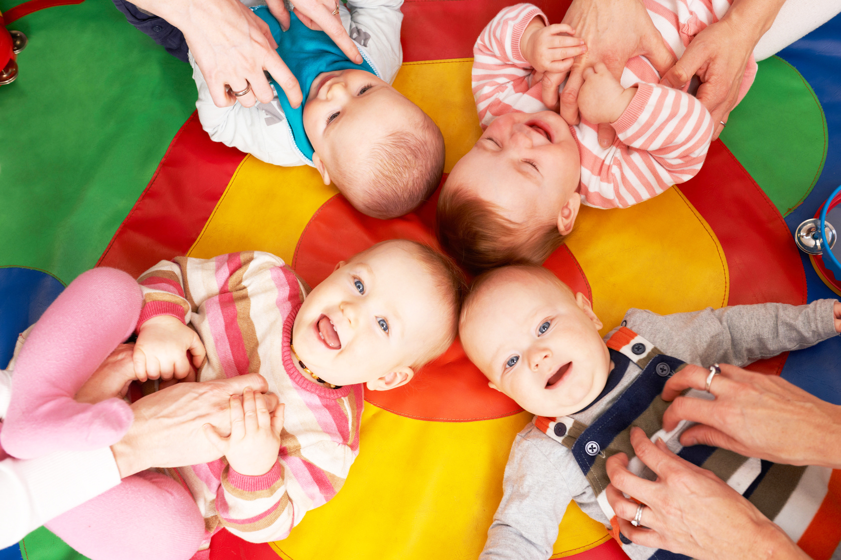 Overhead View Of Babies Having Fun At Nursery Playgroup